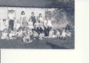 25 of my 50 first cousins with my Grandmother and Grandfather. I am standing to the left of my grandmother.